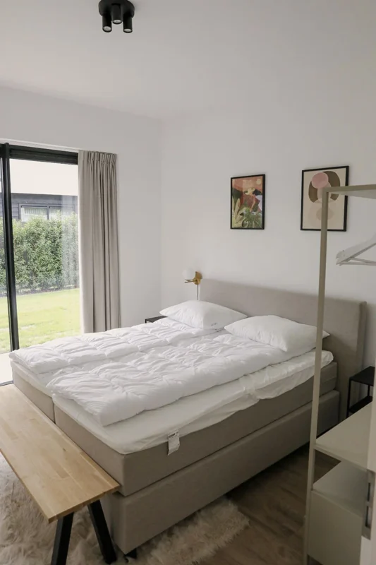 Slaapkamer in een vakantiehuis op Harderwold Villa Resort