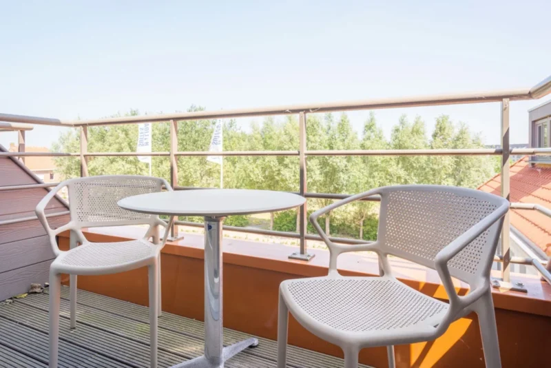 Balkon met zitje bij Holiday Suites Westende